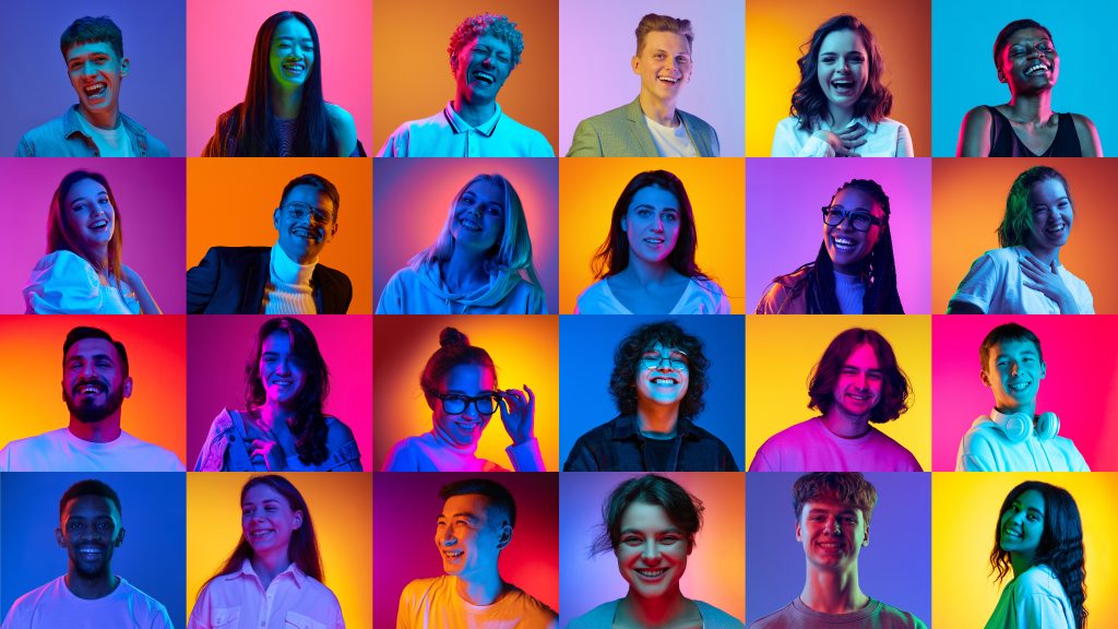 Collage made of portraits of different people of diverse age, gender and nationality smiling against multicolored background in neon light. Concept of human emotions, lifestyle, facial expression. Ad